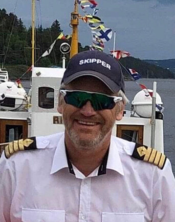 FORNØYD: Skipper og eier Bjørn Salomonsen, populært kalt Bjørn Rigmorfar, er stolt av Riksantikvarens beslutning om å verne fergen sin. Foto: Privat. FORNØYD: Skipper og eier Bjørn Salomonsen, populært kalt Bjørn Rigmorfar, er stolt av Riksantikvarens beslutning om å verne fergen sin. Foto: Privat.