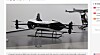 Et elektrisk VTOL-fly står utstilt i et messemiljø.